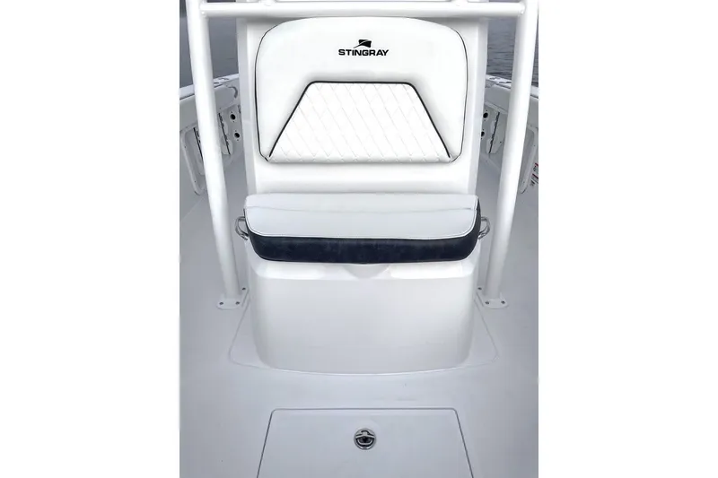 Slide: The Image of 2026 Stingray 236 CC boat seat with white upholstery. - 13