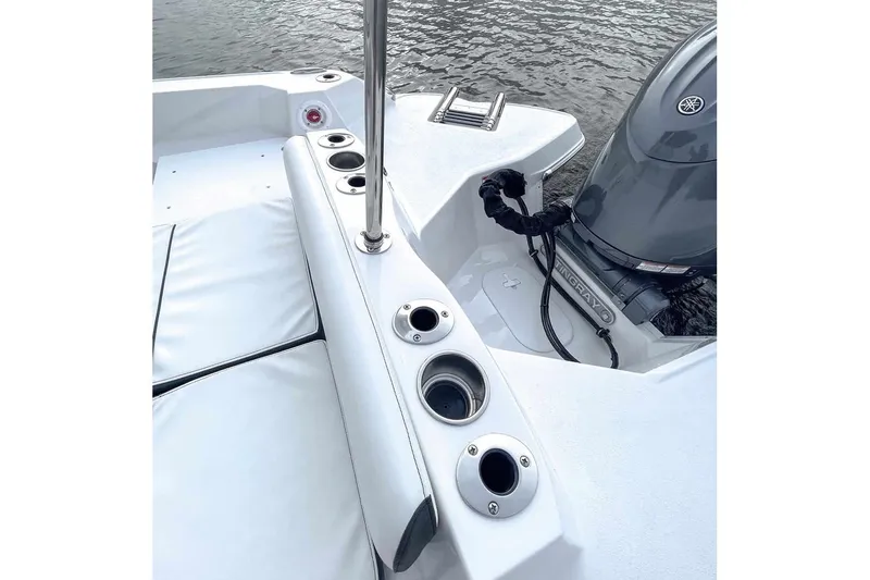 Slide: The Image of Stingray 236 CC 2026 boat with motor and cup holders. - 5