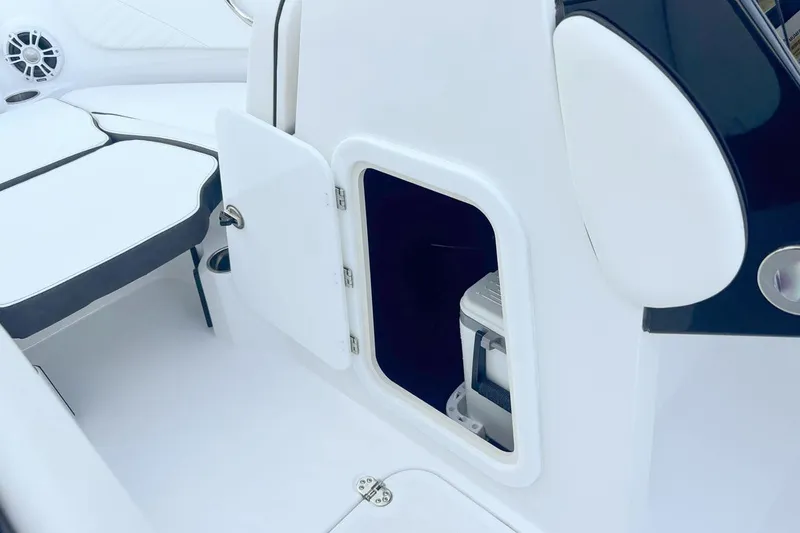 Slide: The Image of Stingray 23 OSX 2026 boat with open storage compartment. - 4