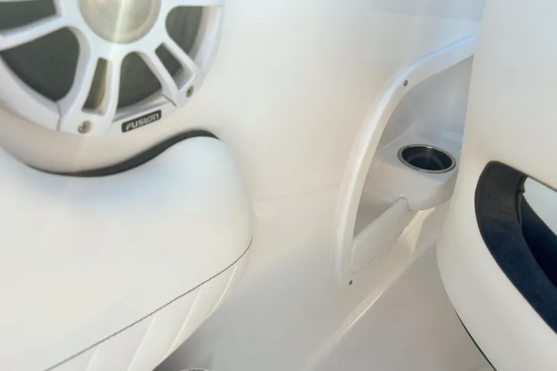 Slide: The Image of Interior of Stingray 23 OSX 2026 with speaker and cup holder. - 9