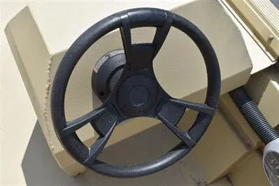 Slide: The Image of Steering wheel of 2025 Lowe Roughneck 1860 boat, showcasing durable design and functionality. - 14