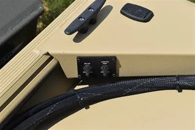 Slide: The Image of 2025 Lowe Roughneck 1860 boat dashboard with control knobs and wiring. - 17