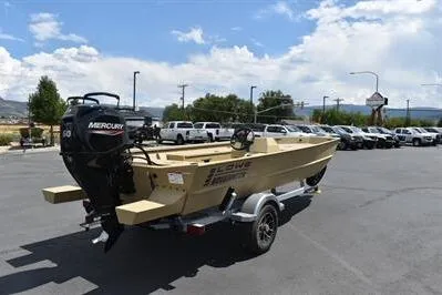 Slide: The Image of 2025 Lowe Roughneck 1860 boat with Mercury engine on trailer in parking lot. - 2