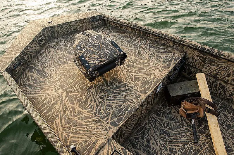 Slide: The Image of Manufacturer Provided Image: 2025 Lowe Roughneck 1860 boat with camouflage design on water. - 21