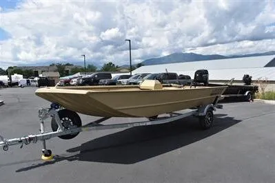 Slide: The Image of 2025 Lowe Roughneck 1860 boat on trailer, parked outdoors under cloudy sky. - 5