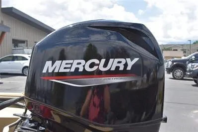 Slide: The Image of 2025 Lowe Roughneck 1860 with Mercury outboard motor in a parking lot setting. - 6
