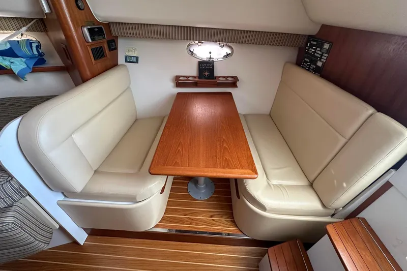 Slide: The Image of Interior of a 2005 Tiara 2900 Open yacht with a cozy dining area. - 6