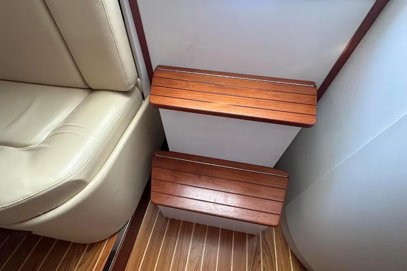 Slide: The Image of Interior of 2005 Tiara 2900 Open boat with wooden steps and beige seating. - 8