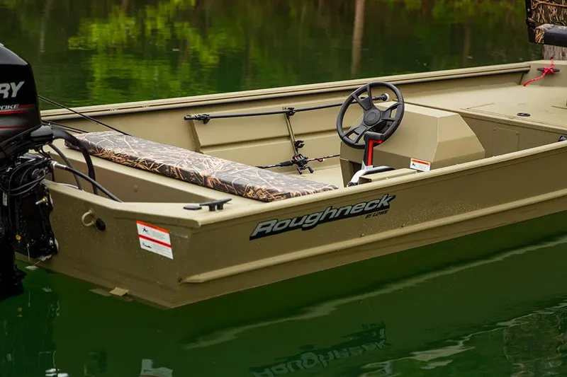 Slide: The Image of Manufacturer Provided Image: 2025 Lowe Roughneck 1860 Rambler boat on calm water, featuring a steering wheel and camouflage seating. - 19