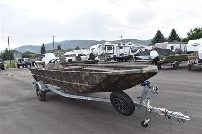 Slide: The Image of 2025 Lowe Roughneck 1860 Rambler boat on trailer in parking lot. - 2