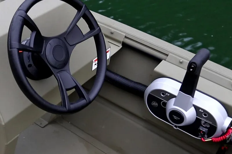 Slide: The Image of Manufacturer Provided Image: 2025 Lowe Roughneck 1860 Rambler boat steering wheel and control panel. - 21