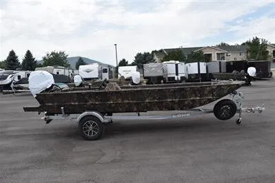 Slide: The Image of 2025 Lowe Roughneck 1860 Rambler boat on trailer, camo design, parked outdoors. - 3
