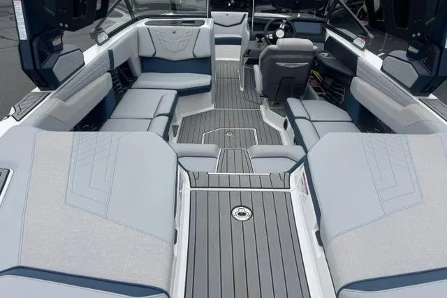 Slide: The Image of 2022 Nautique Super Air Nautique G21 interior with luxurious seating and modern design. - 11