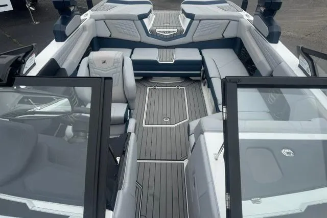 Slide: The Image of Interior view of 2022 Nautique Super Air Nautique G21 boat with sleek seating and modern design. - 12