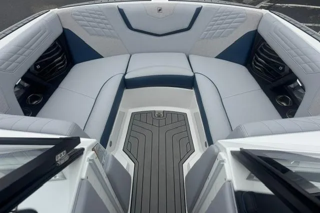 Slide: The Image of 2022 Nautique Super Air Nautique G21 boat interior with luxurious seating and modern design. - 13