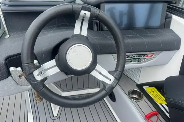 Slide: The Image of Steering wheel and dashboard of 2022 Nautique Super Air Nautique G21 boat. - 14
