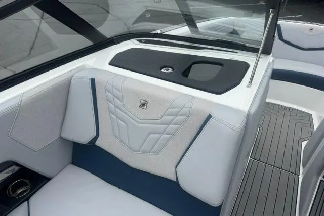 Slide: The Image of 2022 Nautique Super Air Nautique G21 interior with sleek seating and modern design. - 16