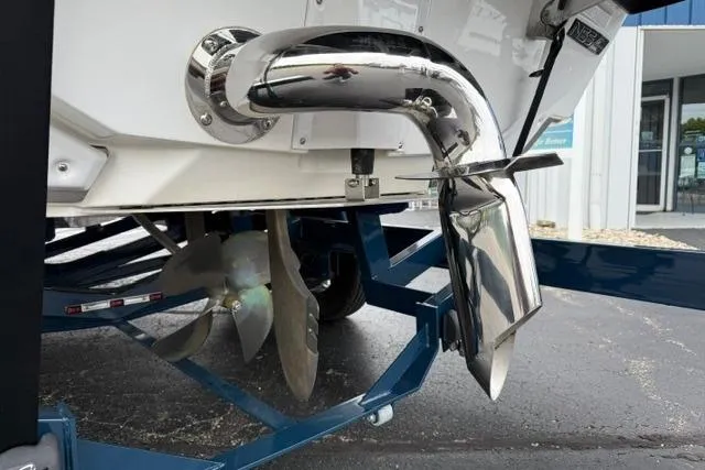 Slide: The Image of 2022 Nautique Super Air Nautique G21 boat propeller and exhaust detail on trailer. - 21