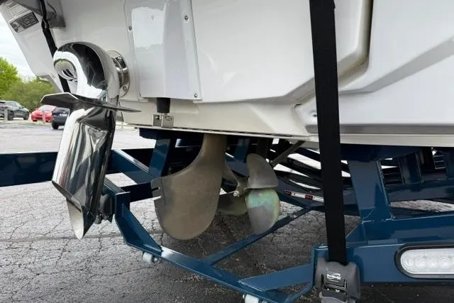 Slide: The Image of 2022 Nautique Super Air Nautique G21 boat propeller and rudder on trailer. - 22