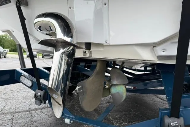 Slide: The Image of 2022 Nautique Super Air Nautique G21 boat propeller and exhaust detail on trailer. - 23