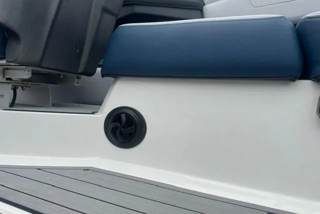 Slide: The Image of 2022 Nautique Super Air Nautique G21 interior with blue seating and speaker detail. - 27
