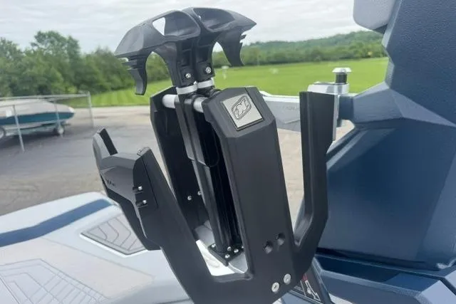 Slide: The Image of 2022 Nautique Super Air Nautique G21 wakeboard rack, close-up view, outdoors. - 31