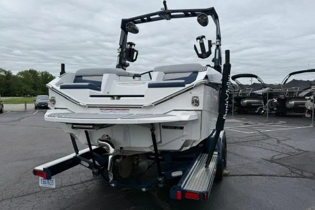 Slide: The Image of 2022 Nautique Super Air Nautique G21 boat, rear view, parked on a trailer. - 5