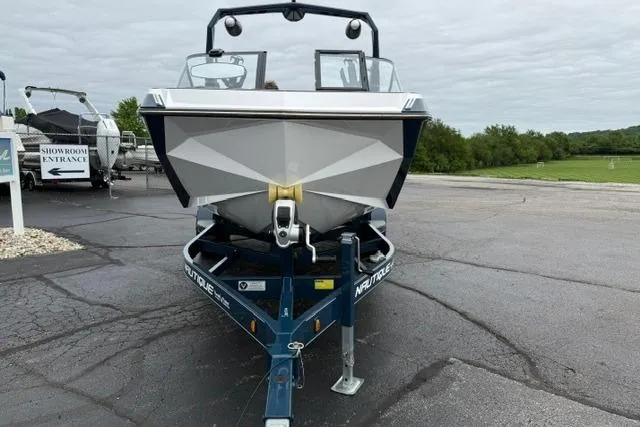 Slide: The Image of 2022 Nautique Super Air Nautique G21 boat on trailer, parked outdoors. - 8