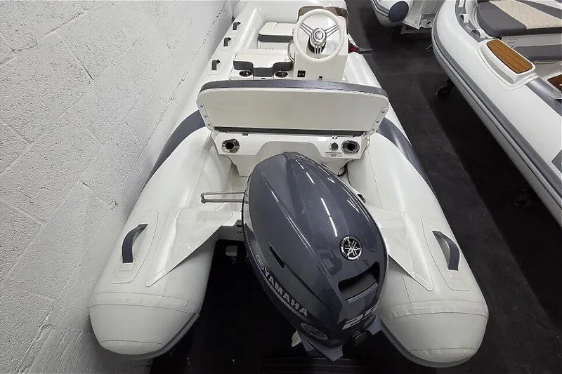 Slide: The Image of 2023 Walker Bay 365 STX inflatable boat with Yamaha outboard motor in showroom. - 4