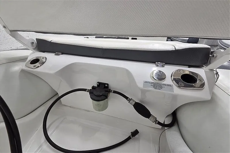 Slide: The Image of 2023 Walker Bay 365 STX boat interior with seating and cup holders. - 6