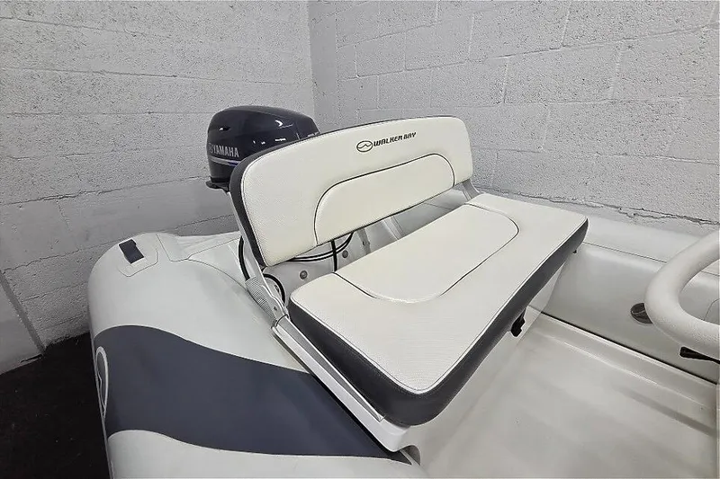 Slide: The Image of 2023 Walker Bay 365 STX boat with Yamaha motor, featuring cushioned seating. - 7