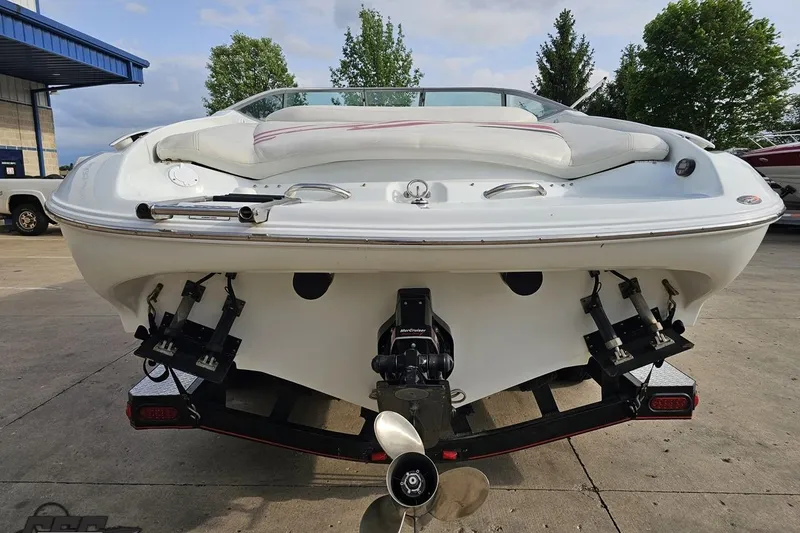 Slide: The Image of 2004 Baja 275 boat rear view with dual propellers and white seating. - 26