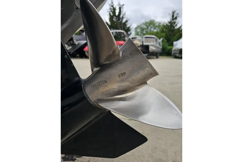 Slide: The Image of Close-up of a 2004 Baja 275 boat propeller, showcasing its metallic blades. - 28