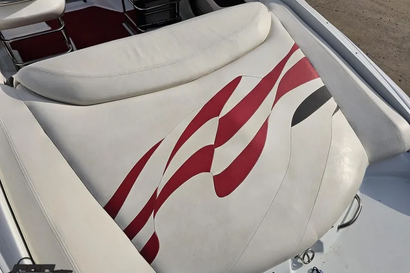 Slide: The Image of 2004 Baja 275 boat seat with red and black wave design. - 33