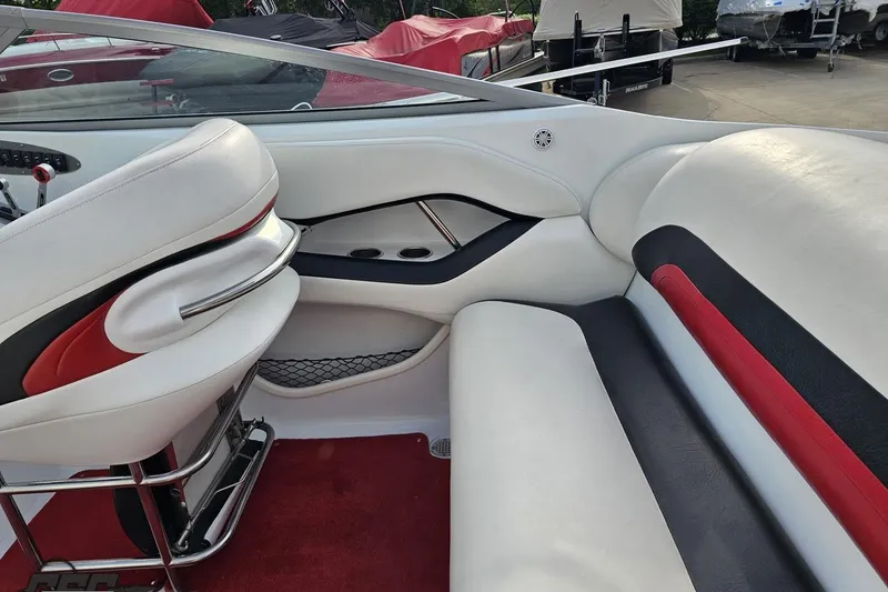 Slide: The Image of Interior of a 2004 Baja 275 boat with white and red seating. - 44