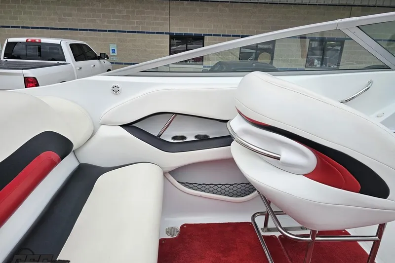 Slide: The Image of Interior of a 2004 Baja 275 boat with white and red seating. - 47
