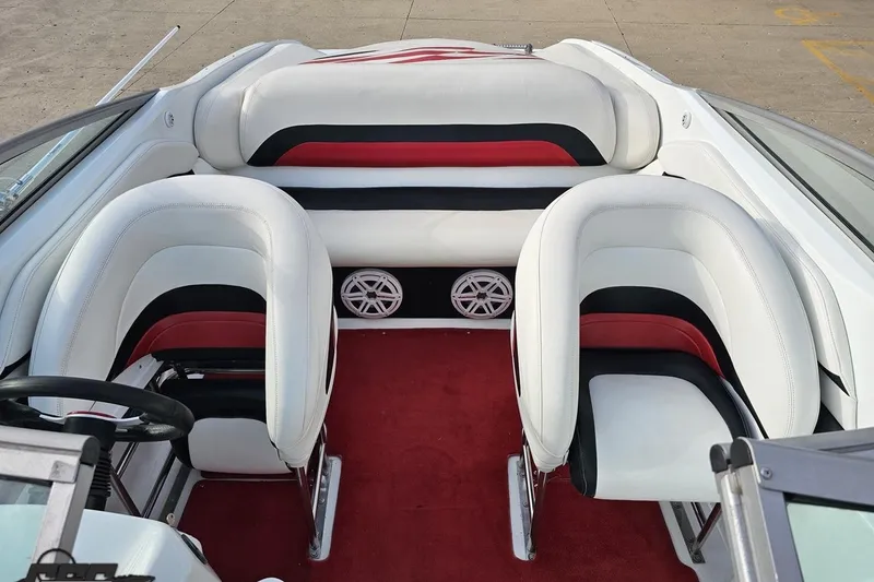 Slide: The Image of Interior of a 2004 Baja 275 boat with white and red seating. - 65