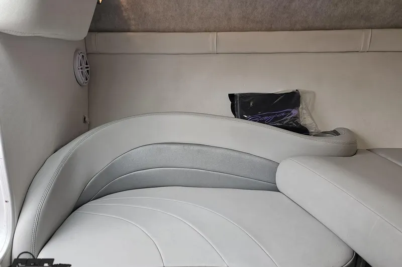 Slide: The Image of Interior of a 2004 Baja 275 boat with gray cushioned seating. - 75
