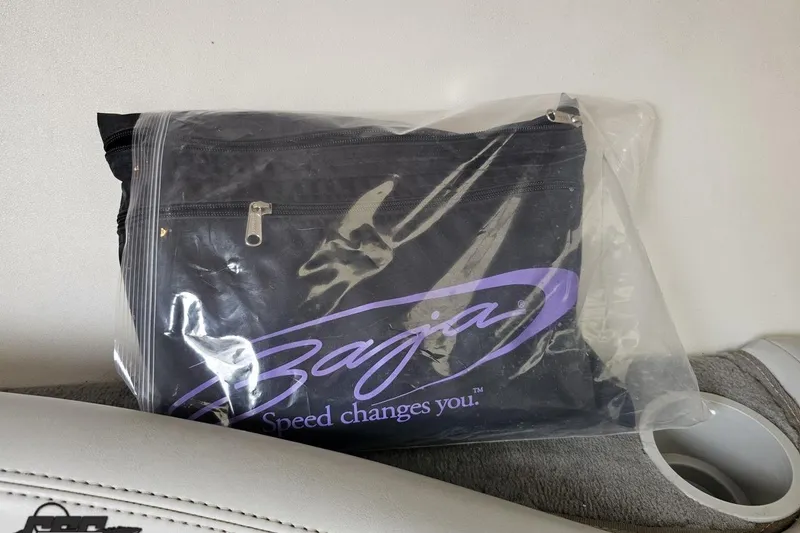 Slide: The Image of Bag with Baja logo and "Speed changes you" slogan, 2004 Baja 275 model. - 76