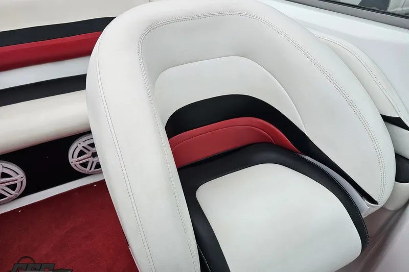 Slide: The Image of White, red, and black boat seat interior of 2004 Baja 275. - 79