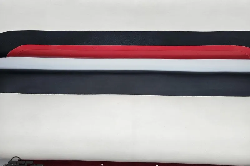 Slide: The Image of Black, red, and white boat upholstery for 2004 Baja 275 model. - 86
