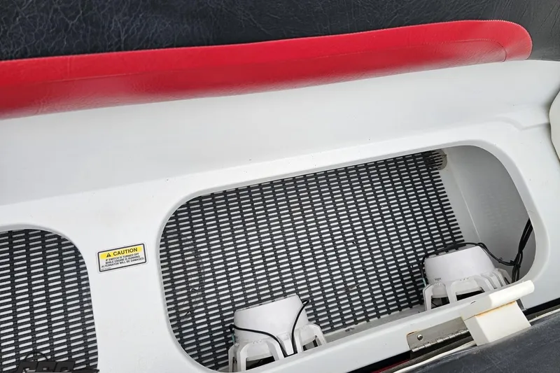 Slide: The Image of Interior of a 2004 Baja 275 boat with red and white seating. - 87