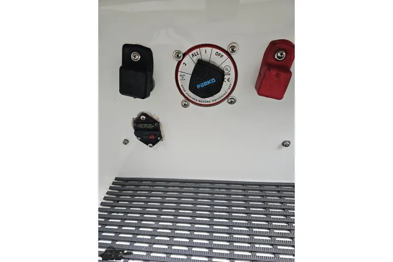 Slide: The Image of Control panel of a 2004 Baja 275 boat with Perko switch and connectors. - 89