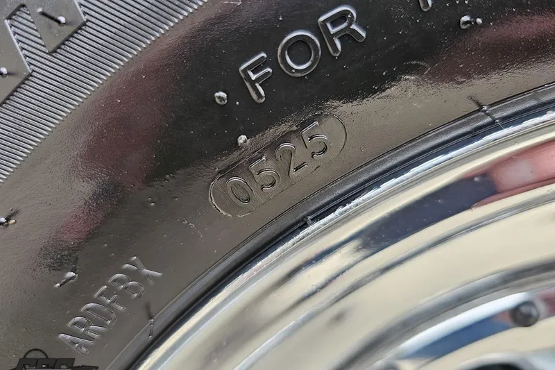 Slide: The Image of Close-up of a tire with code "0525" on a 2004 Baja 275. - 9