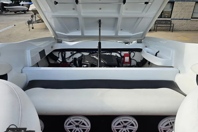 Slide: The Image of Open engine compartment of a 2004 Baja 275 boat, showcasing interior components. - 91
