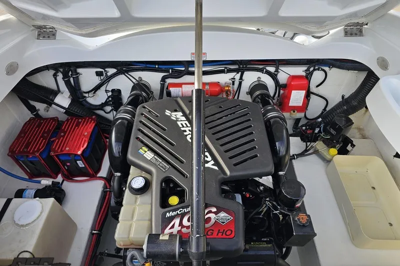 Slide: The Image of Engine compartment of a 2004 Baja 275 boat featuring a MerCruiser 496 MAG HO engine. - 92