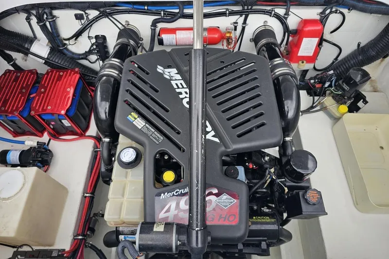 Slide: The Image of Engine compartment of a 2004 Baja 275 boat with MerCruiser 496 HO engine. - 93