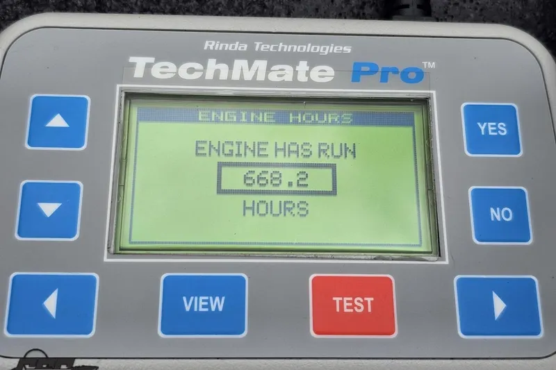 Slide: The Image of TechMate Pro displaying 668.2 engine hours for 2004 Baja 275 model. - 95