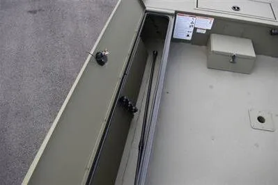 Slide: The Image of 2025 Lowe Roughneck 1860 Rambler boat interior storage compartment. - 12