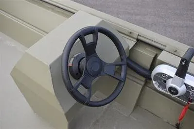Slide: The Image of Steering wheel of 2025 Lowe Roughneck 1860 Rambler boat, showcasing control panel details. - 13